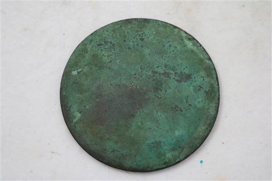 A Chinese bronze circular hand mirror, Ming dynasty, diameter 9.5cm